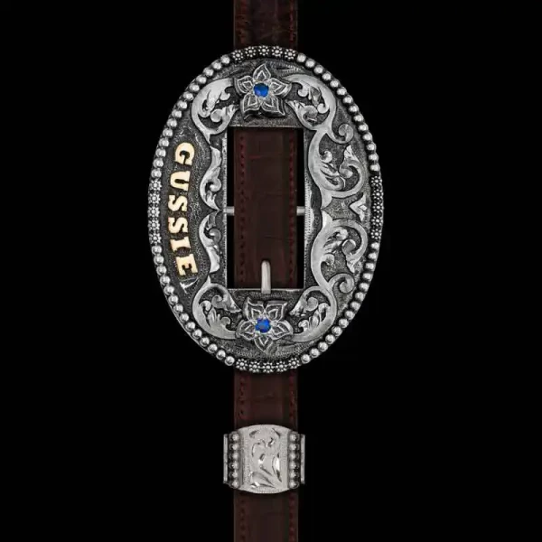 Our Percheron Headstall Buckle is a timeless piece,  ready to be shown off at shows or just around the arena. Handcrafted on a German Silver base, this headstall is nothing short of details from the bead and berry edge to the hand-engraved scrolls accente